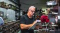 Mature worker doing inventory in a metallurgical factory