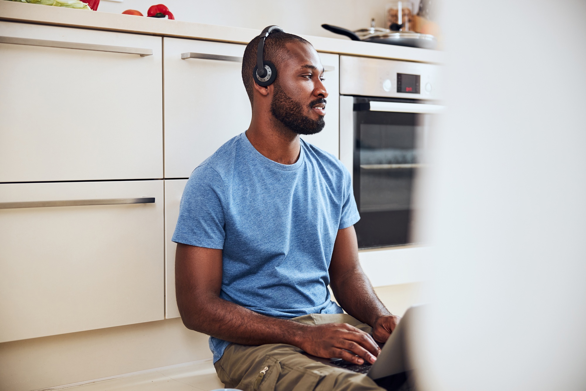 Multiracial man is staring to the side