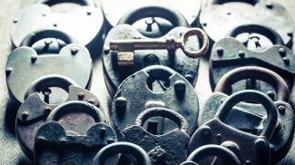 One key and padlocks, conceptual image