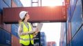 Staff worker work check stock inventory for control loading Containers box.