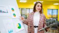 Young woman leader, presenter, make a business presentation at a conference in the office.